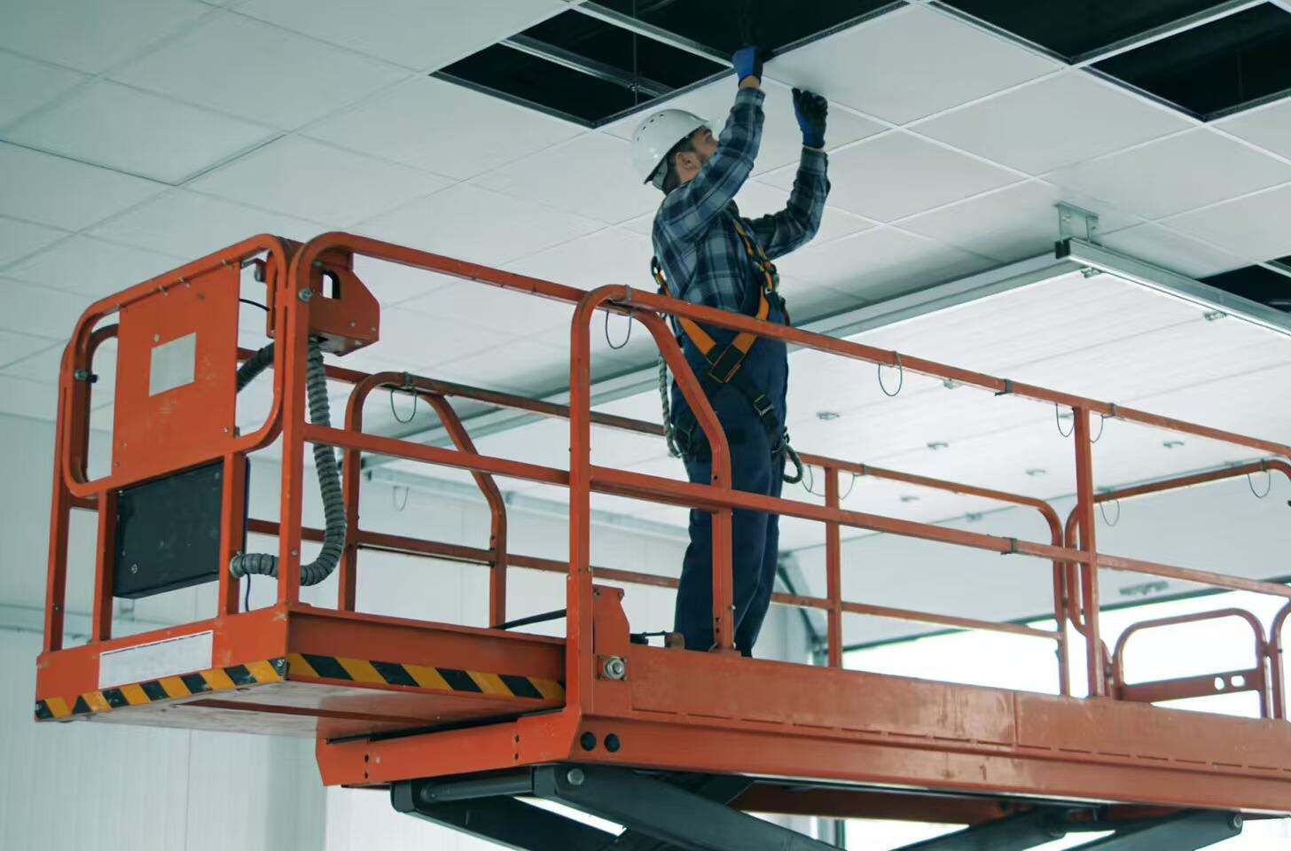 Benefits of Using Scissor Lifts for Ceiling and Wall Installation